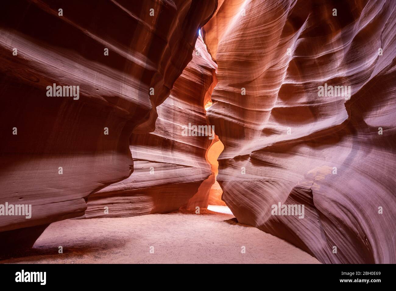 Interior of the Antelope Canyon, with red sandstone carved into curved surfaces Stock Photo