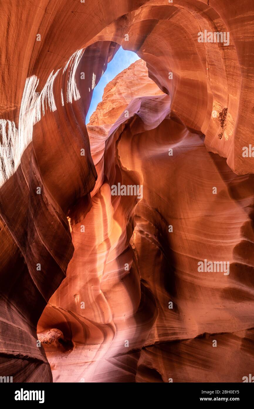 he vault of the Upper Antelope Canyon, with the blue sky visible through an opening Stock Photo