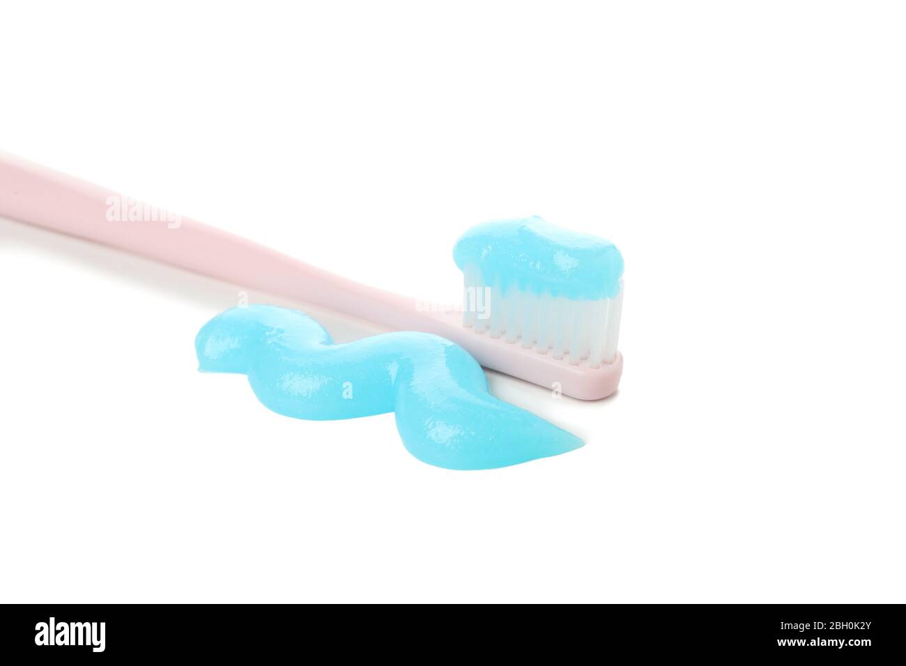 Toothbrush with toothpaste isolated on white background Stock Photo - Alamy