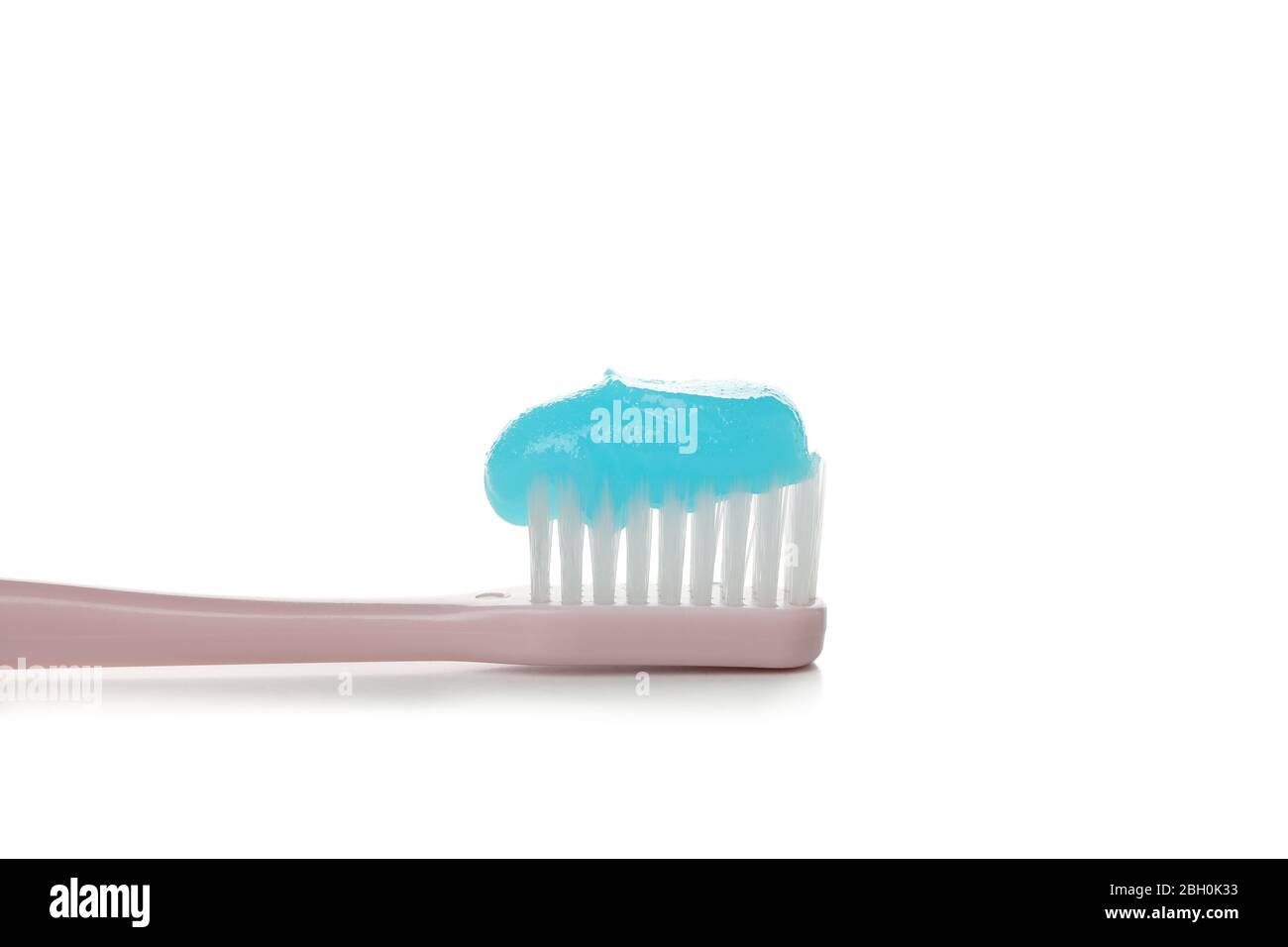 Toothbrush with toothpaste isolated on white background Stock Photo - Alamy
