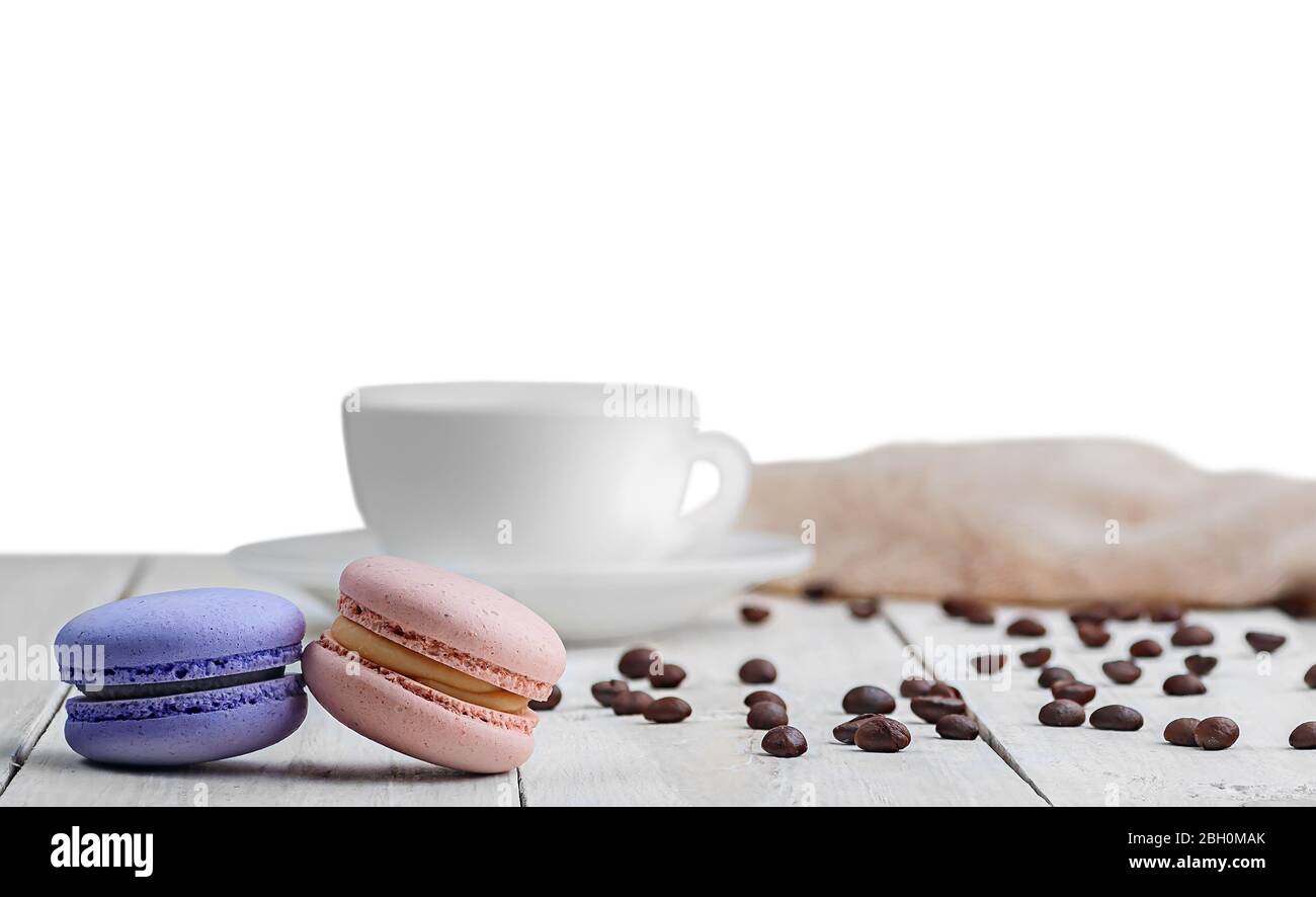 Two macaroons with cup coffee beans Stock Photo