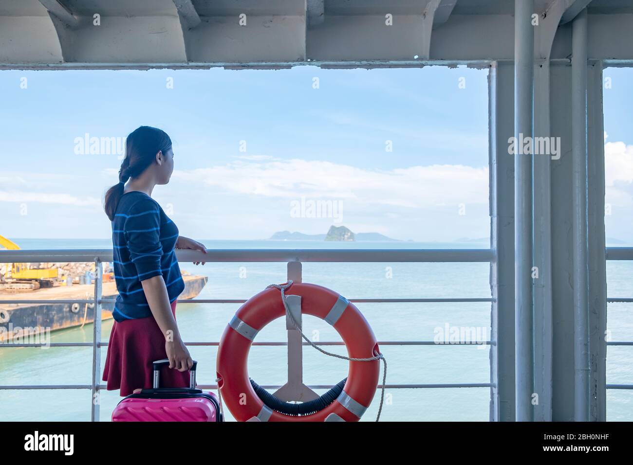 Woman on ferry boat. Thai lady travel on ferry. Stock Photo
