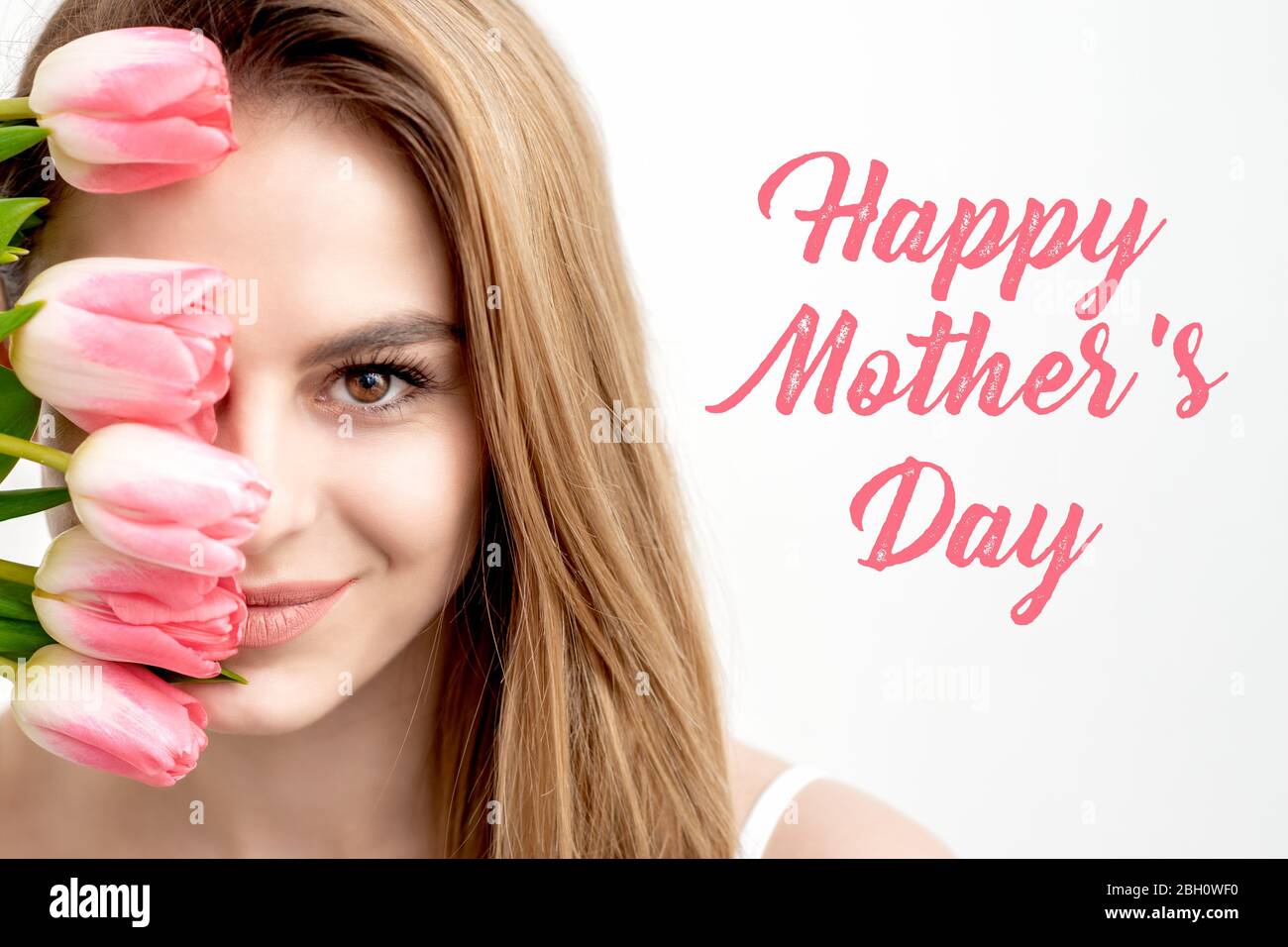 Happy Mother's Day pink text sign and portrait of smiling young ...