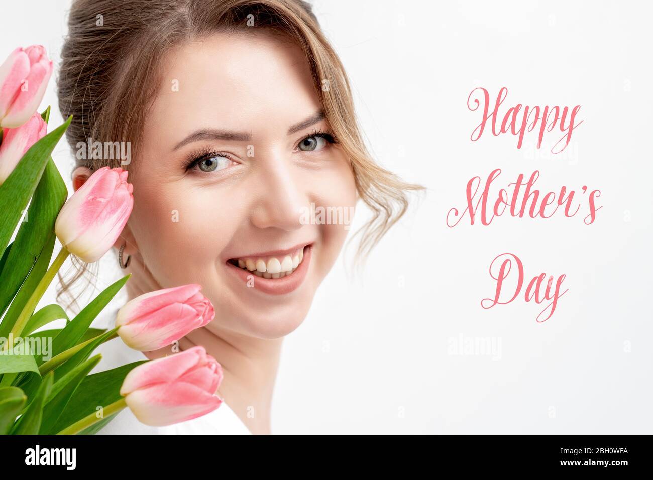 Happy Mother's Day pink text and portrait of young woman with pink ...