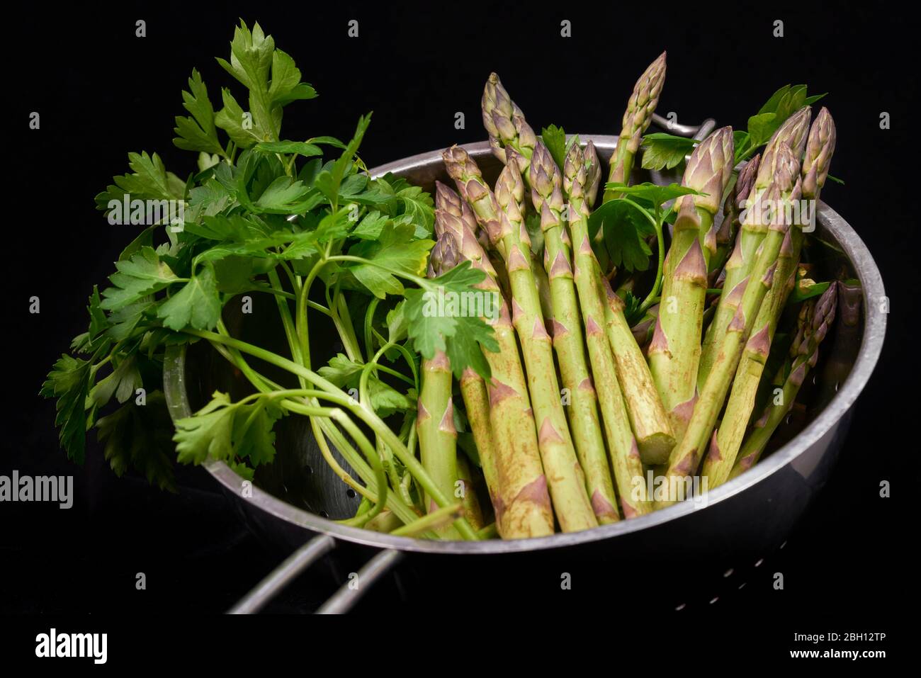 green asparagus cut on black background Stock Photo