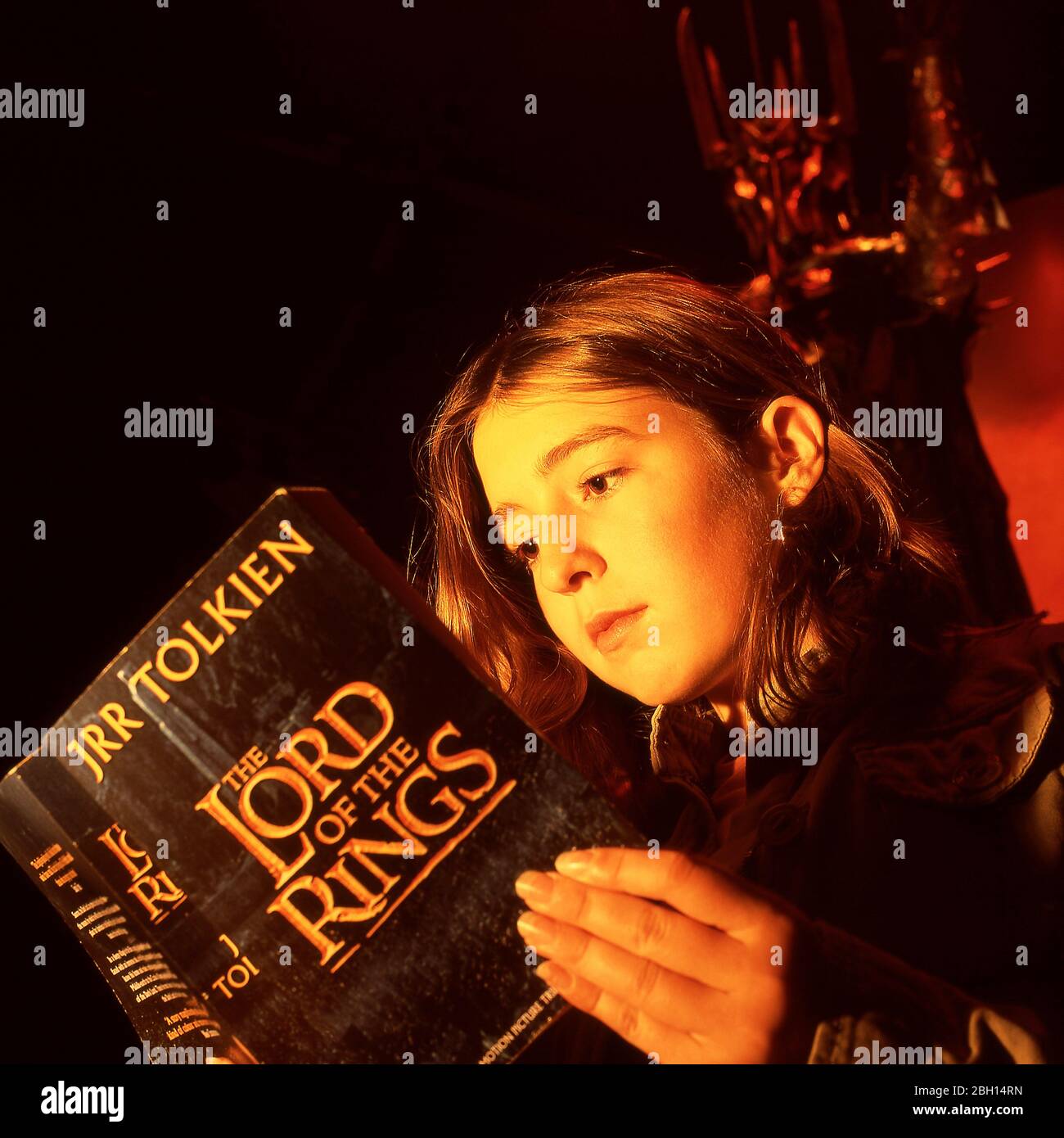 Child reading a copy of the Lord of the Rings Stock Photo