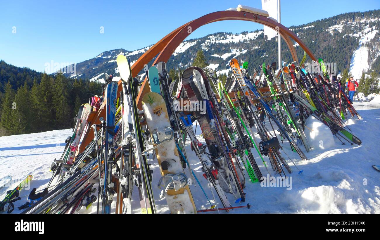 ski tourism - a lot of skis parked outside of a mountain hut, Germany, Bavaria, Allgaeu Stock Photo