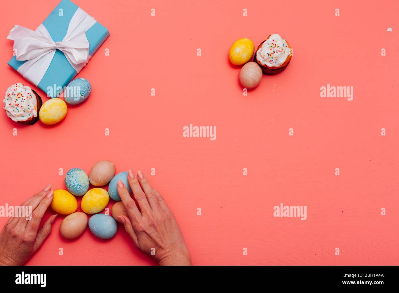 multi-colored eggs for the Easter holiday on a pink background Stock Photo