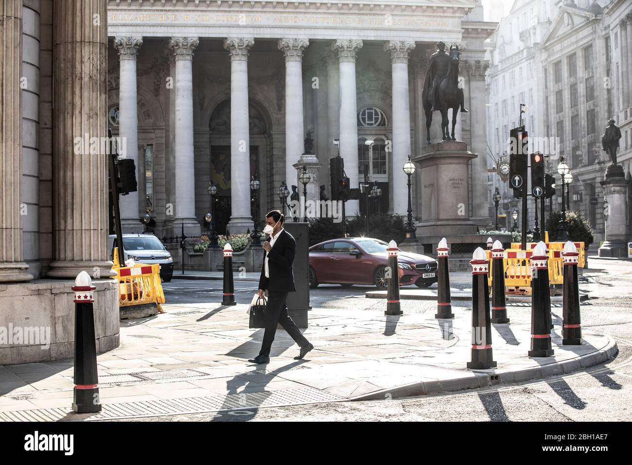 London, UK. 23rd Apr 2020. A lone commuter makes his way across The Royal Exchange at Bank early this morning in the City of London, as lockdown measures need to be eased out in the next three to four weeks amid coronavirus for the economy to recover. City of London lockdown, England, United Kingdom 23rd April, 2020 Credit: Jeff Gilbert/Alamy Live News Stock Photo