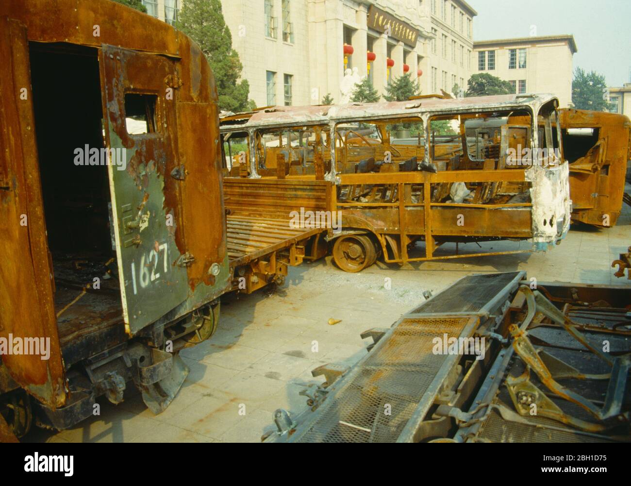 China, Beijing, Military Museum propaganda display of burnt out buses and army trucks resulting from alledged riots. Stock Photo