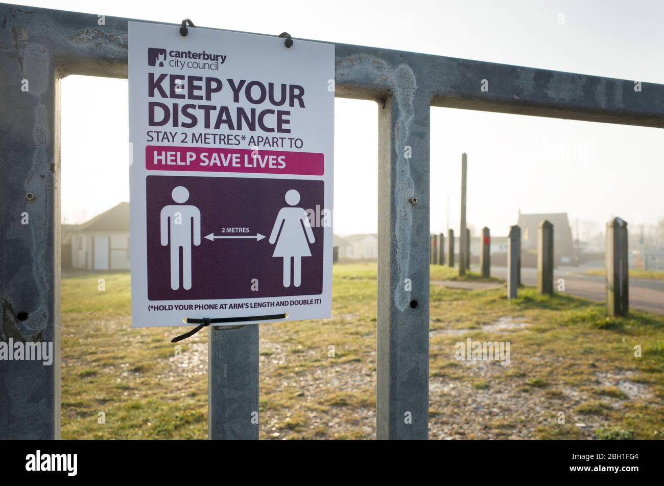 Social distancing Coronavirus Covid 19 safety notice on a beach in Seasalter Whitstable Kent England UK Stock Photo