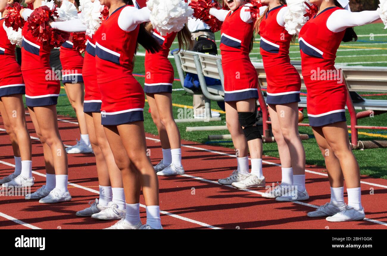 Cheerleading squad performing cheer hires stock photography and images