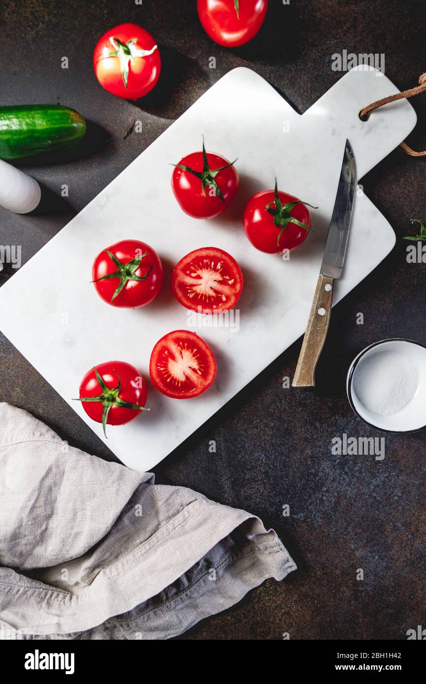 Cherry tomatoes on a white marble tray. Stock Photo