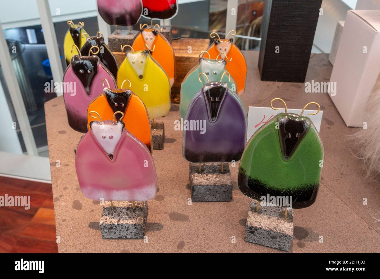 Hand crafted glass sheep ornaments, Icelandic gifts for sale in the museum shop, Perlan ('The Pearl') in Reykjavik, Iceland. Stock Photo