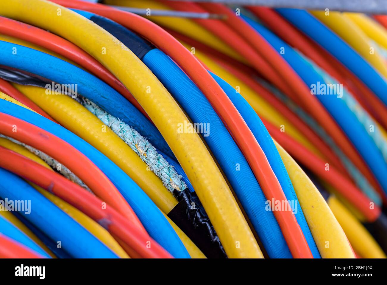 Multicolor electric industrial wires closeup, outdoors Stock Photo