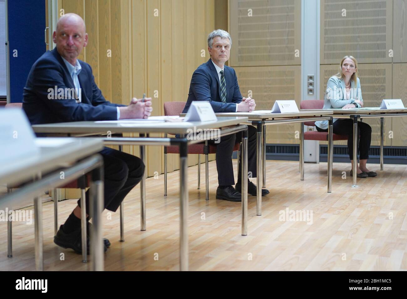 23 April 2020, Berlin: Jochen Sindberg (l-r), Senior Criminal Investigation Director and Head of the Department for Combating White-Collar Crime, Thomas Fels, Senior Public Prosecutor and Head of the Department for Combating Money Laundering, and Nina Thom, Senior Public Prosecutor and Head of the Department for Asset Recovery, are sitting at a press conference of the Berlin Public Prosecutor's Office on the subject of 'Combating fraud in connection with Corona emergency aid'. Photo: Jörg Carstensen/dpa Stock Photo