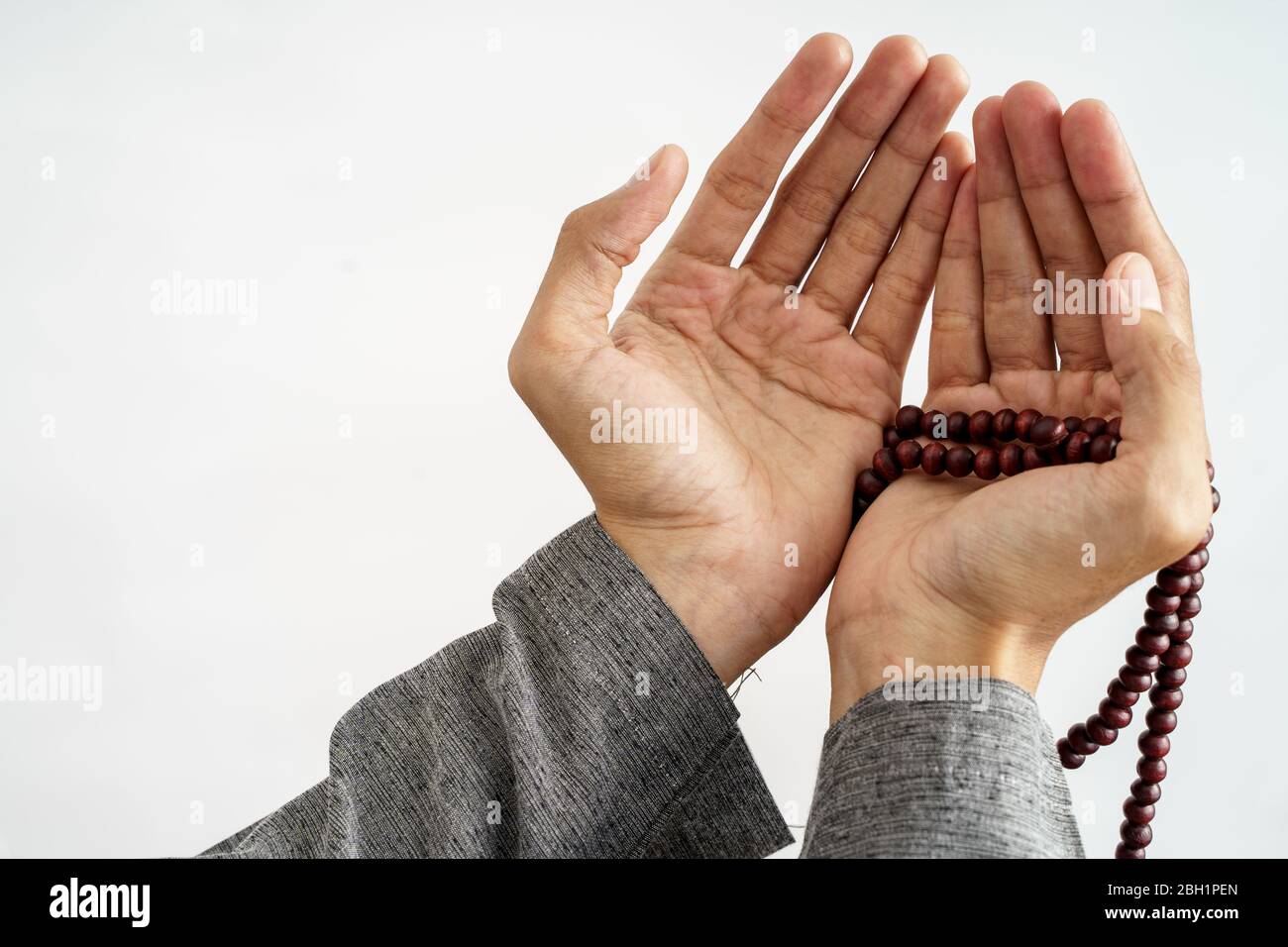 gesture of hand open arm while pray in islamic culture carrying prayer