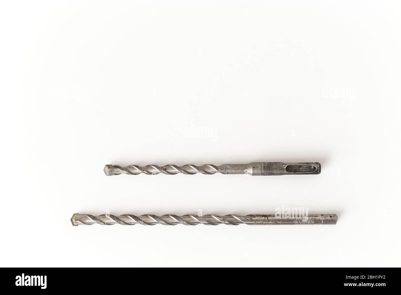 Concrete drill bits isolated on white. SDS hammer bit and drill