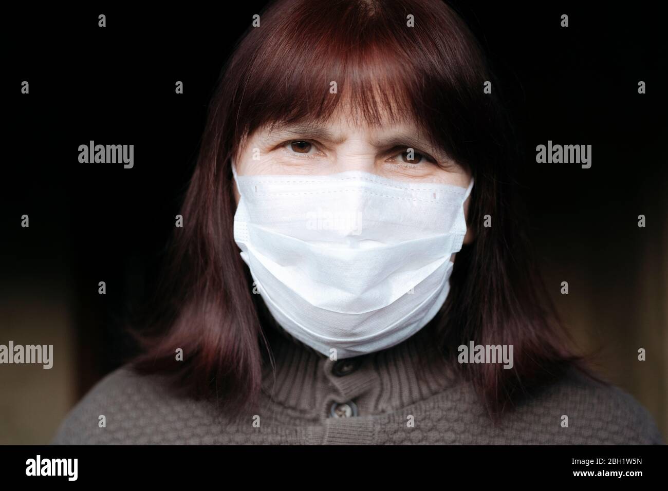 Portrait senior women wearing mask home hi-res stock photography and ...