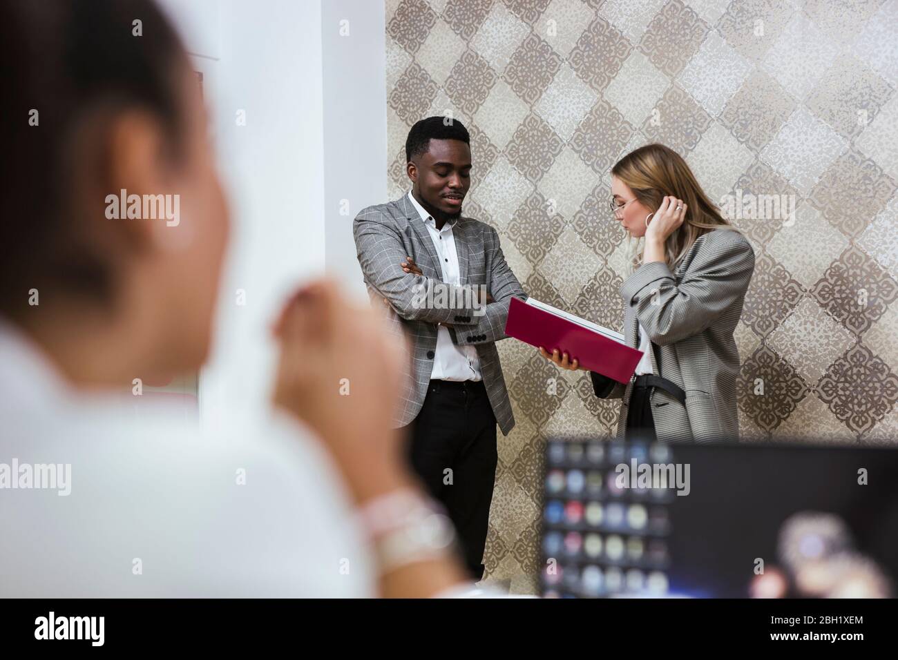 Multiracial colleagues having meeting hi-res stock photography and ...