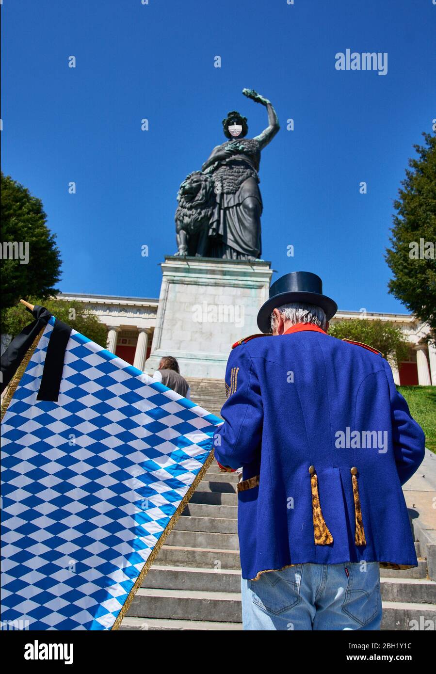 Munich, Germany, April 22, 2020. Symbol photo for the cancellation of oktoberfest beer festival WIESN 2020 due to the Corona virus disease (COVID-19) on April 22, 2020 in Munich, Germany. Note: photo montage of the mouth protection of the Bavaria statue © Peter Schatz / Alamy Live News Stock Photo