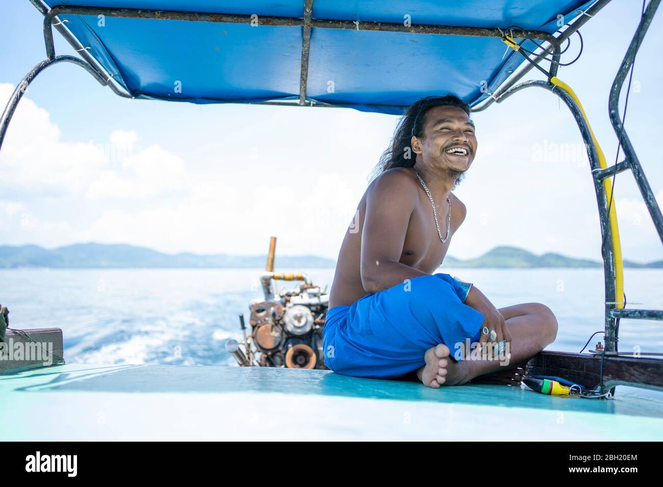 Happy young native man on a boat trip, Ko Yao Yai, Thailand Stock Photo