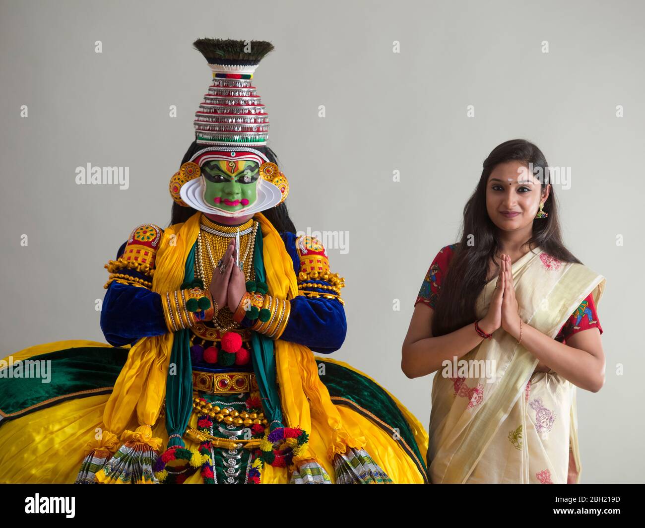 namaste kerala high resolution stock photography and images alamy https www alamy com kathakali dancer and a young woman standing together with their hands folded image354701465 html