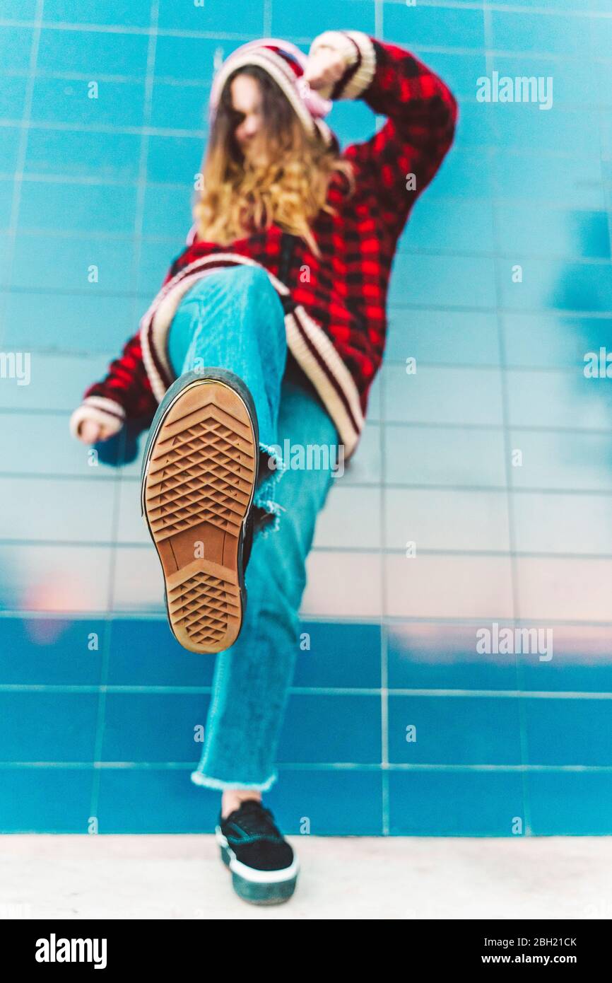 Teenage girl kicking Stock Photo