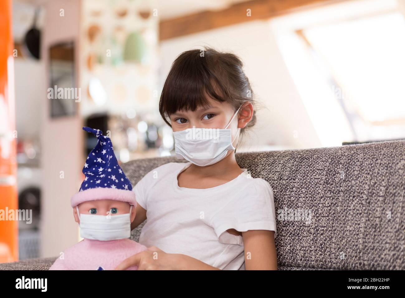 Girl wearing mask at home Stock Photo Alamy