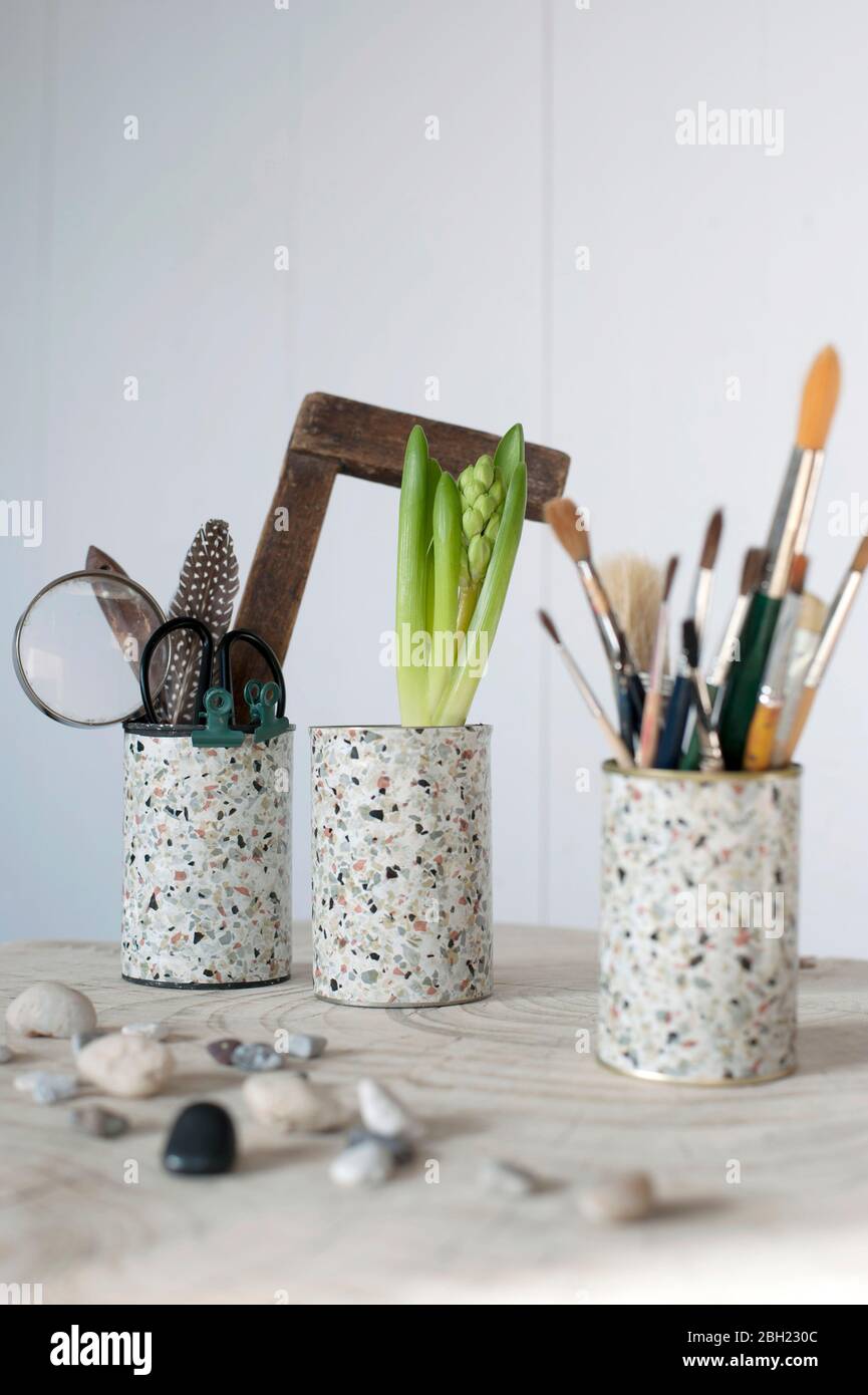 DIY cans decorated with terrazzo adhesive tape Stock Photo