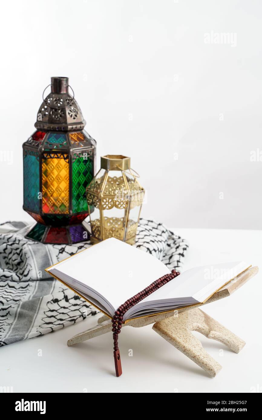 Arabic candle lantern with holy quran, Ramadan kareem background Stock Photo