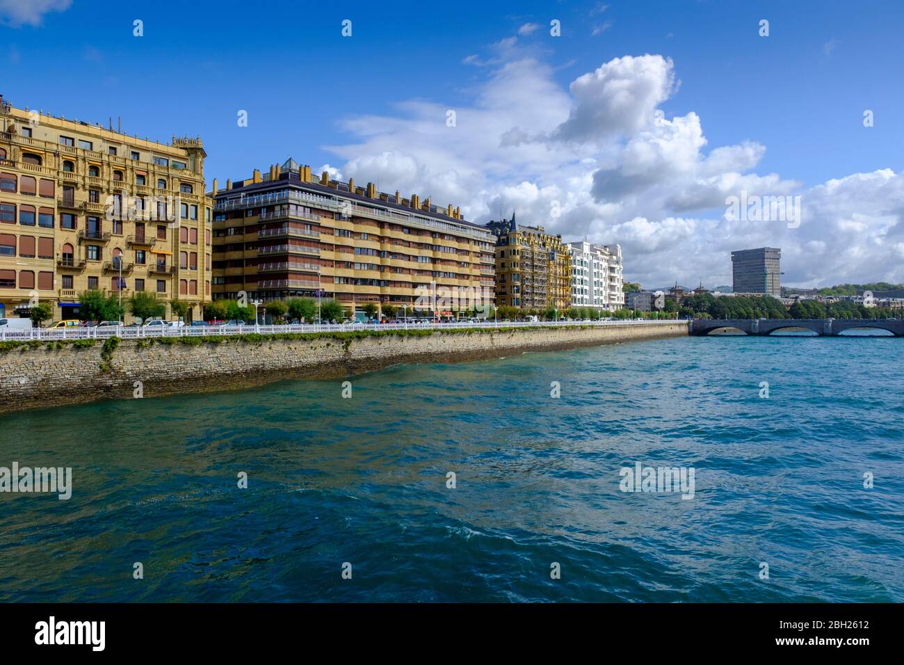 Spain, Gipuzkoa, San Sebastian, City buildings along bank of Urumea river Stock Photo