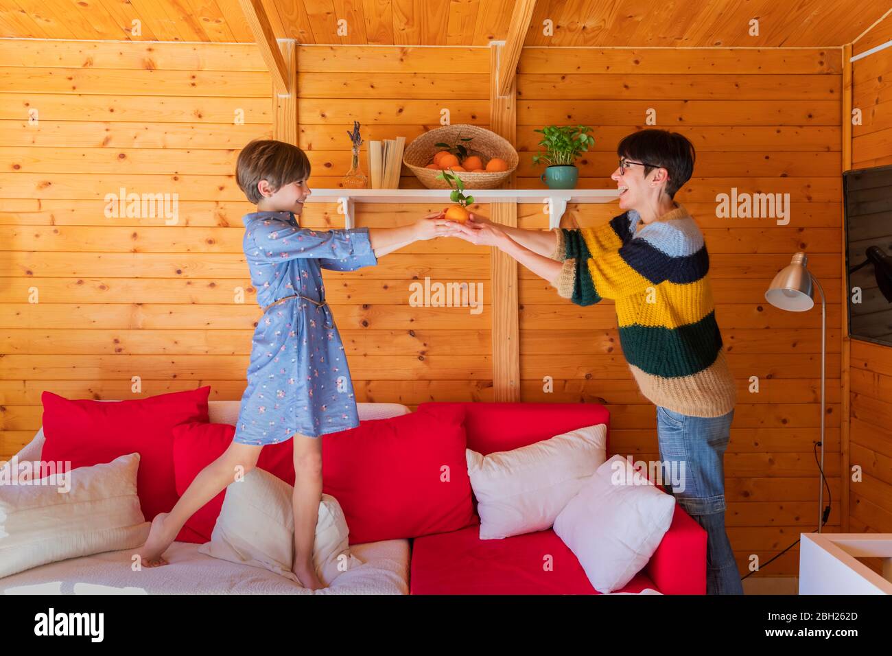 Mother and daughter preparing countryside property to guests