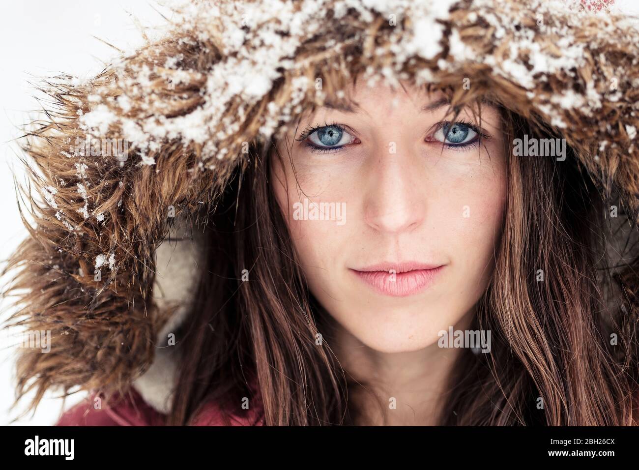 Portrait of young woman with blue eyes in winter Stock Photo