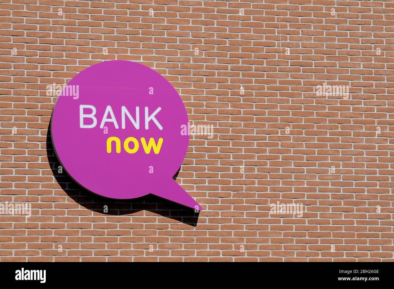 Manno, Ticino, Switzerland - 14th April 2020 : Logo of the Swiss Bank Now  company hanging on a brick wall in Manno, Switzerland. Bank Now is a  subsidi Stock Photo - Alamy