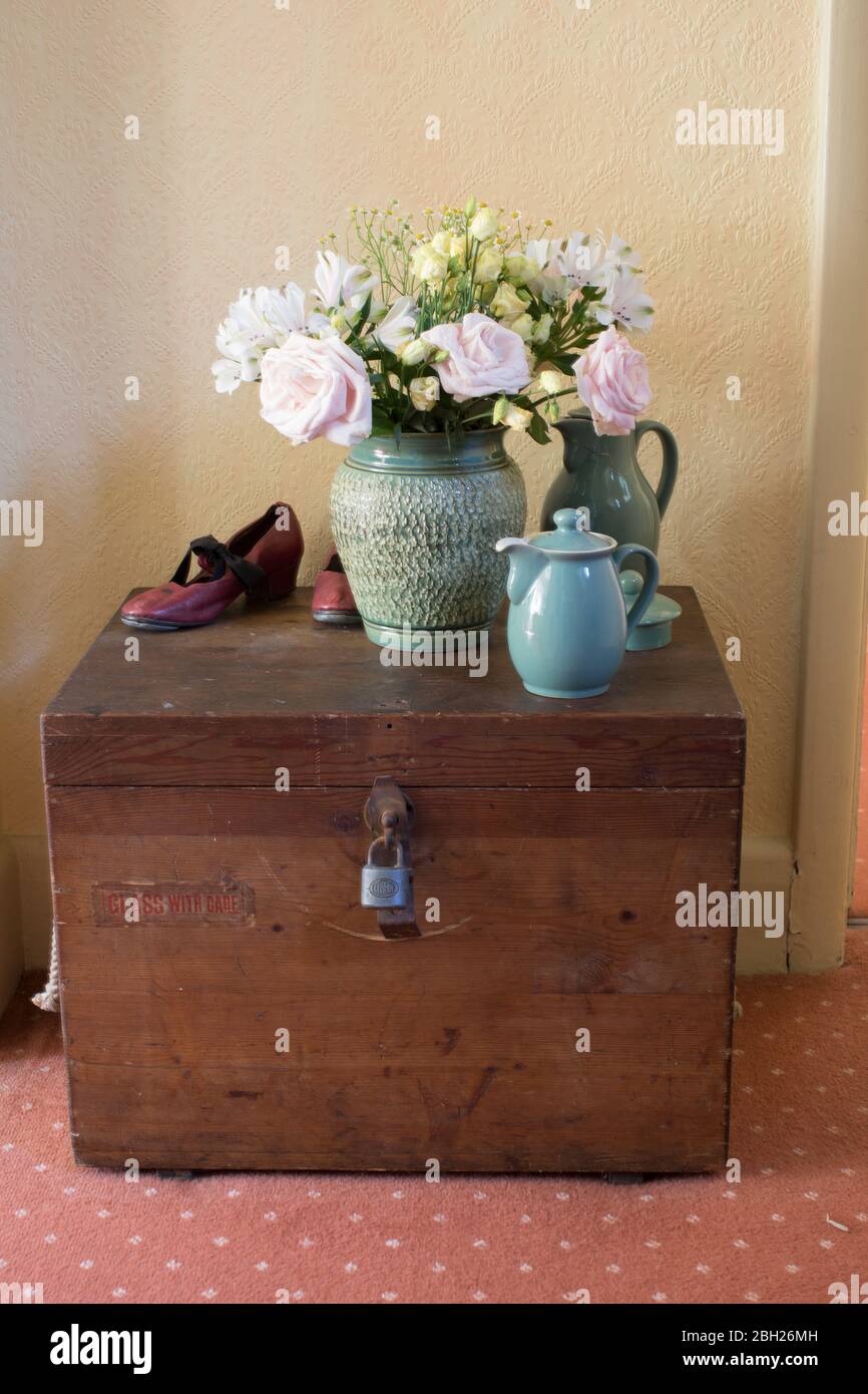 Traditional seaman’s chest with ceramics and tap shoes Stock Photo