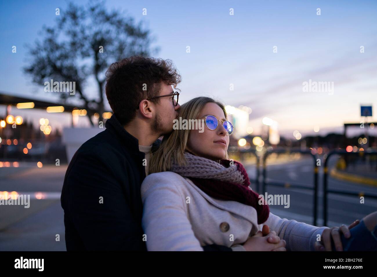 Young couple in love at evening twilight Stock Photo