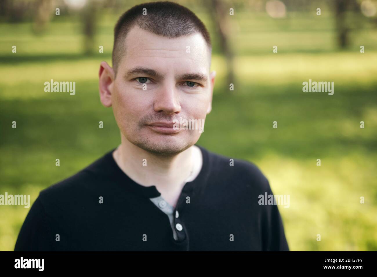 Portrait of man in a park Stock Photo