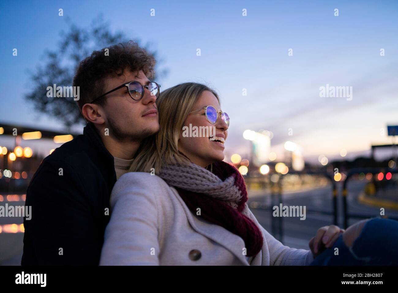 Young couple in love at evening twilight Stock Photo