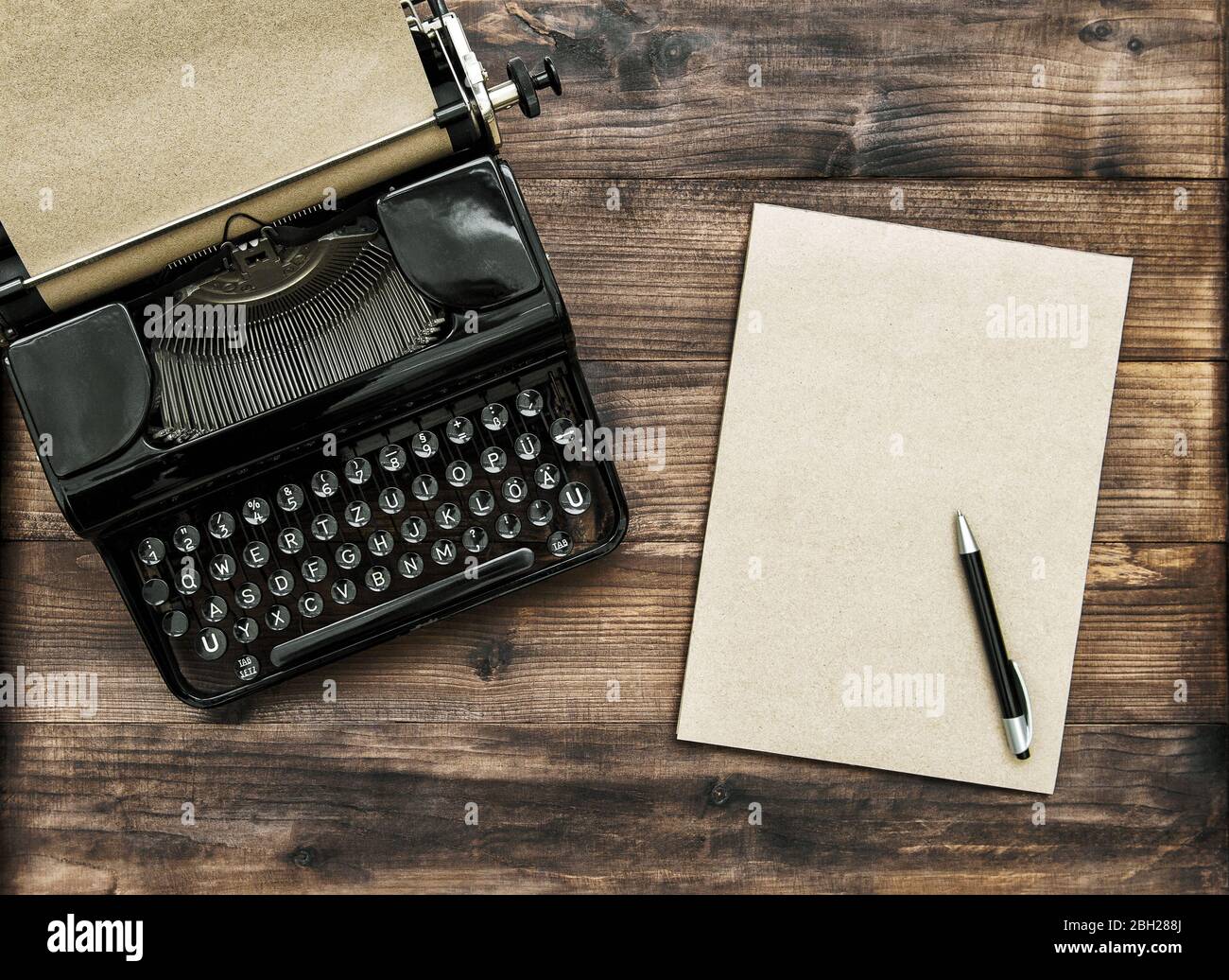 Antique typewriter with paper note book. Creativity concept Stock Photo