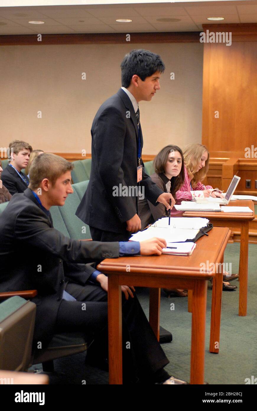 Austin Texas USA: Teen 'lawyers' argue a case as Texas high school students participate in mock court hearings as part of YMCA Youth in Government program at the State Capitol. Students learn the legal profession by acting out trials in competition with their peers. ©Bob Daemmrich Stock Photo