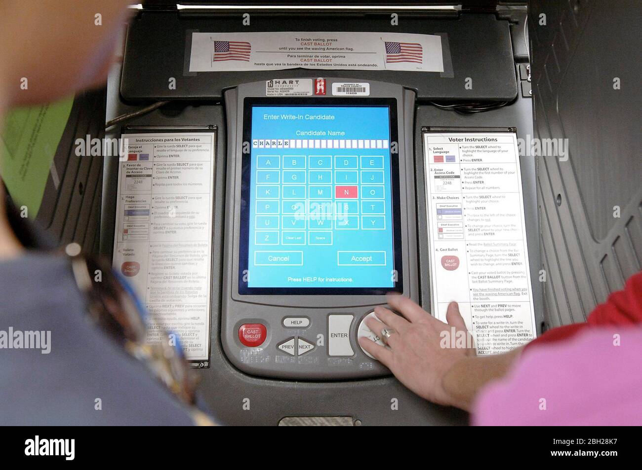Austin, Texas USA, November 3, 2006: An election trainer demonstrates the difficulty of casting a write-in vote on the E-Slate electronic voting machines used in many Texas counties for the November election. ©Bob Daemmrich Stock Photo