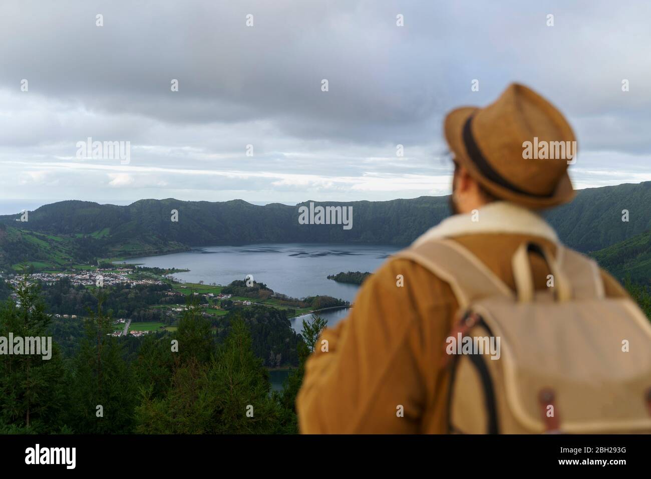 Rear view of man looking at scenic landscape, Sao Miguel Island, Azores, Portugal Stock Photo