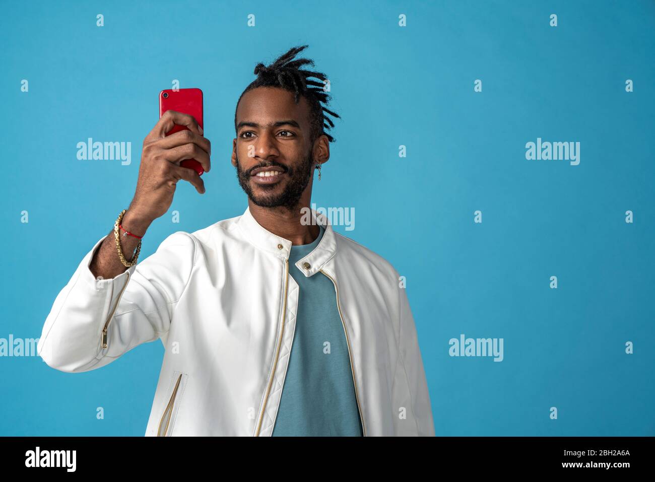 Portrait of stylish young man taking a selfie Stock Photo