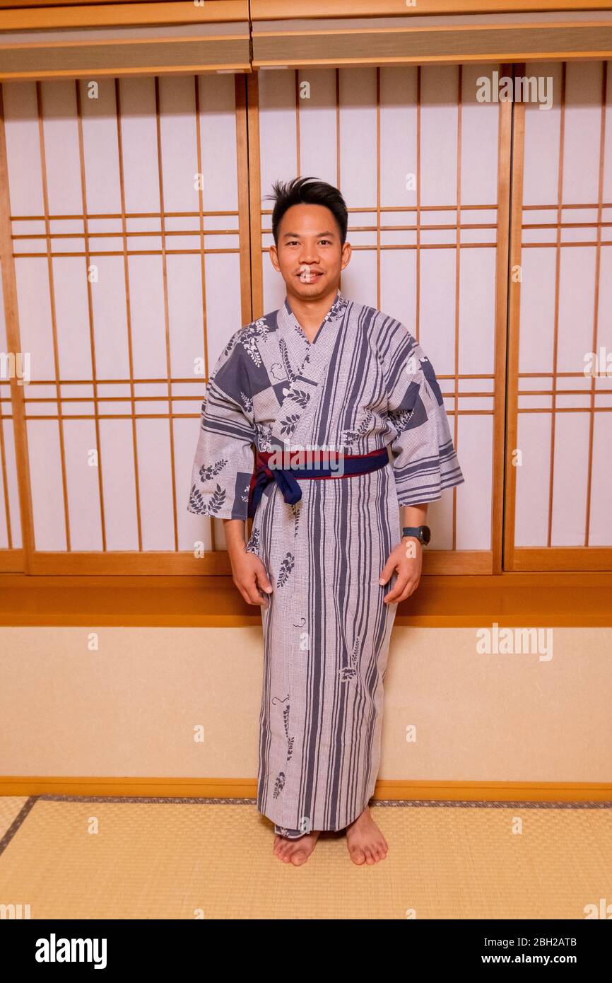 A tourist man in Japanese dress yukata in the oriental hotel in Lake Kawaguchiko, Japan February 9,2020 Stock Photo