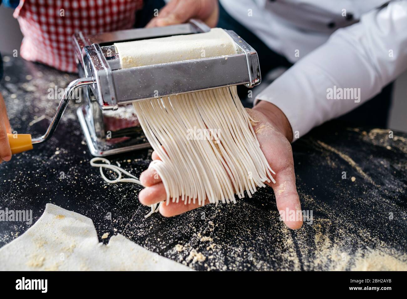 Making Homemade Pasta With Pasta Machine In Kitchen At Home Stock Photo Alamy