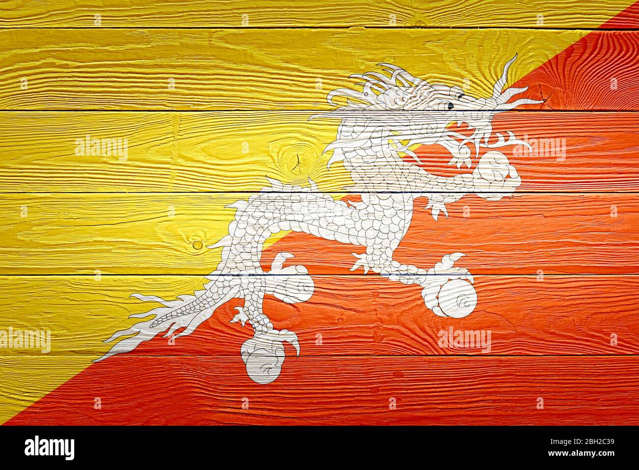 Bhutan flag painted on old wood plank background. Brushed natural light ...