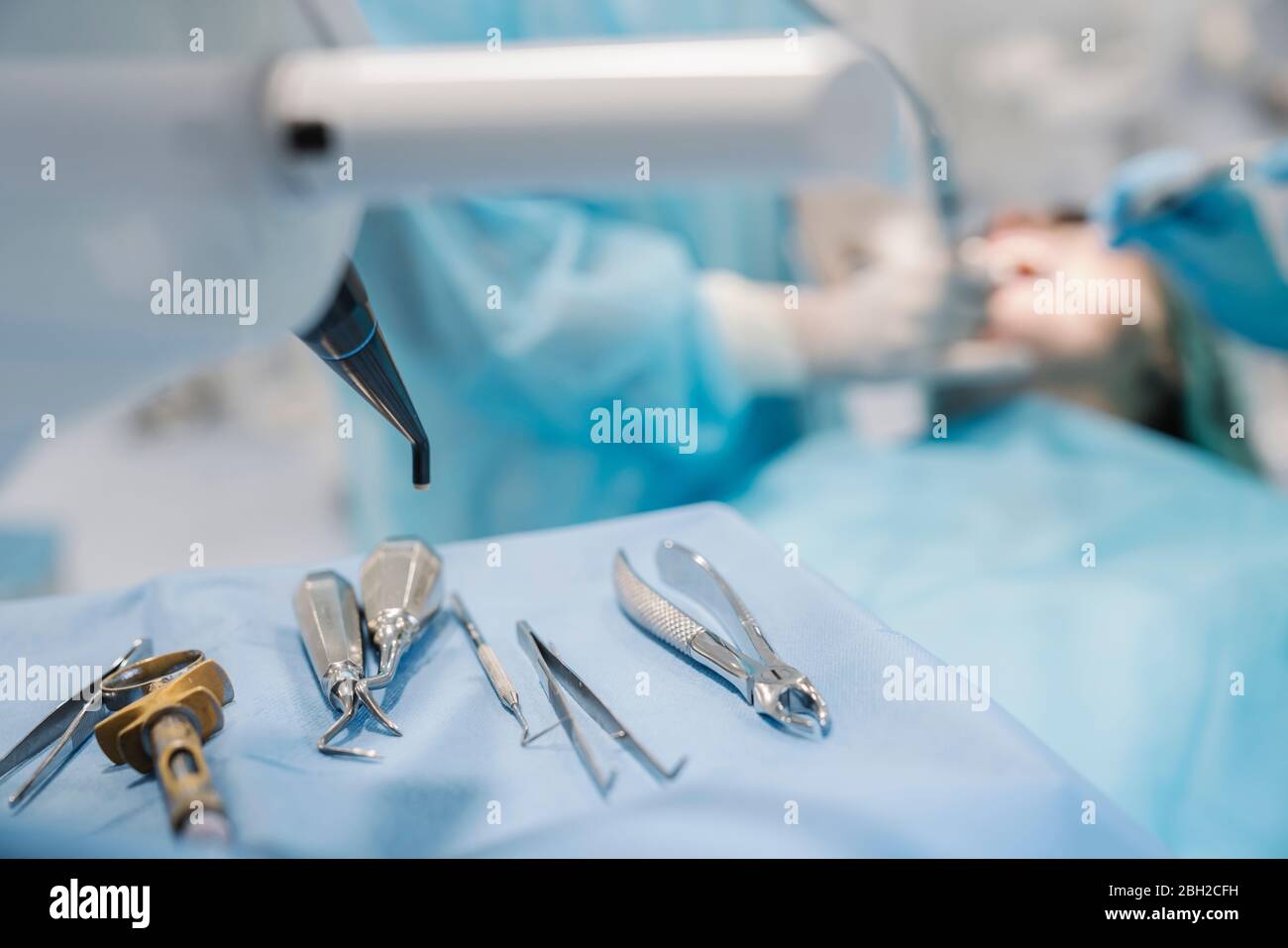 Dental intruments in dental clinic, used at treatment, focus on foreground Stock Photo