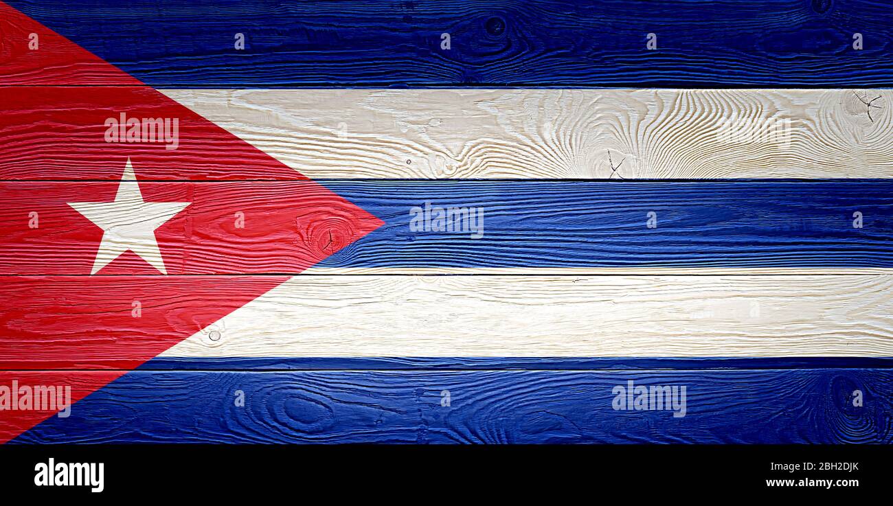 Cuba flag painted on old wood plank background. Brushed natural light ...