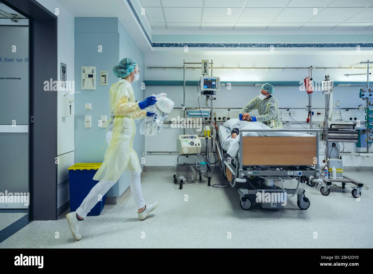 Doctors in a hurry caring for patient in emergency care unit of a hospital Stock Photo